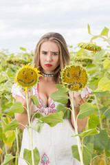 Girl on a sunflower field