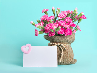 beautiful blooming of  pink carnation flowers on with card text