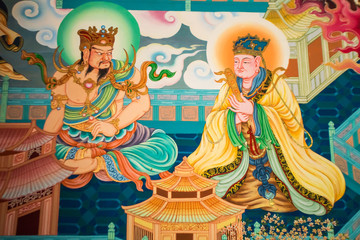 Mural in native thai style painting on the wall of Buddhist chur