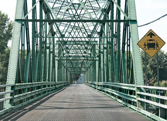 Empty large green 2 lanes metal bridge