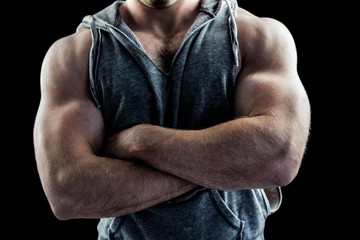 Handsome bodybuilder with arms crossed