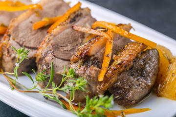 Roasted duck breast in orange on the plate