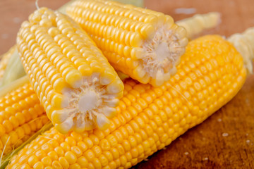 Corn cob on rustic wooden table