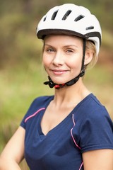 Young pretty happy biker looking at camera