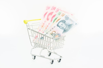 Miniature shopping cart with Chinese Yuan banknotes 