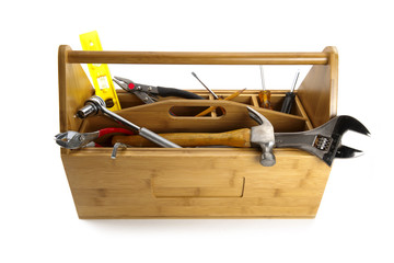 Wooden toolbox with tools isolated on white
