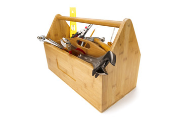 Wooden toolbox with tools isolated on white
