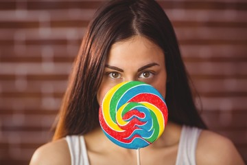 Pretty hipster with lollipop