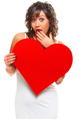 Young woman holding red paper heart