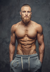 Obraz na płótnie Canvas Shirtless muscular guy with beard
