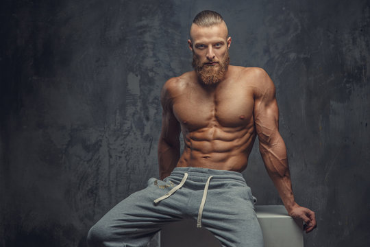 Shirtless muscular guy with beard