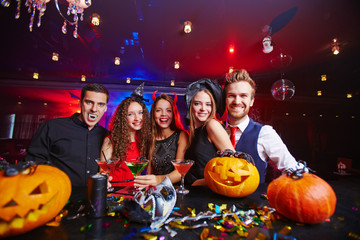 Party among pumpkins © pressmaster