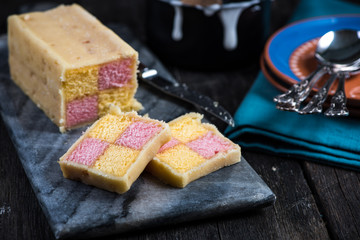 Serving Battenberg checked cake