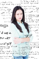 Fototapeta premium Composite image of serious woman looking at camera