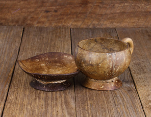  coconut shell coffee cup  on old wooden background