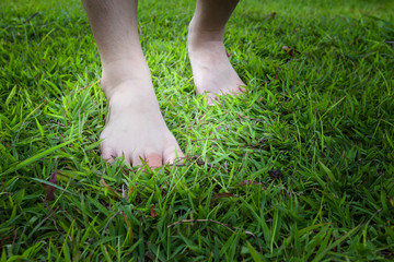 injury female  feet  on the grass