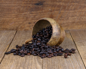 Coffee beans on wooden background