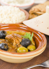 Chicken Tagine - Moroccan chicken tagine with olives, preserved lemon and fennel, served bulgur wheat.

