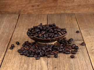 Coffee beans on wooden background