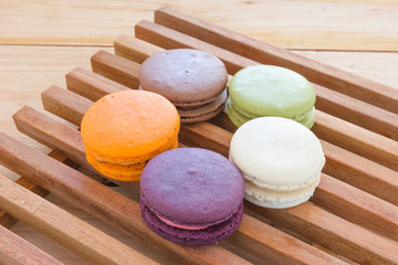 Colorful French Macarons On wood panel