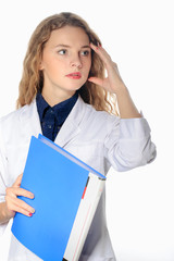 Female medical doctor is is alarmed while in a white robe