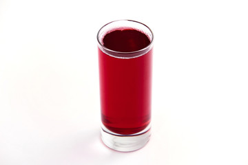 Obraz premium fresh cool red glass of cherry juice isolated at white background