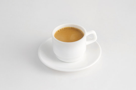 hot cup of coffee with milk isolated at white background