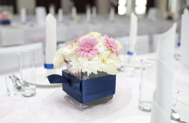 Wedding table with bouquet of gerbera flowers