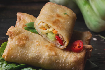 Fried spring rolls with  shrimps, bok choi, chili pepper and hot