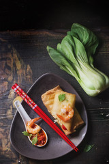 Fried spring rolls with  shrimps, bok choi, chili pepper and hot