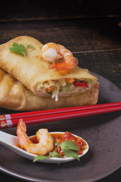 Fried spring rolls with  shrimps, bok choi, chili pepper and hot