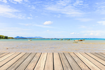Fototapeta premium Wood decking with blue sky and sea for background usage