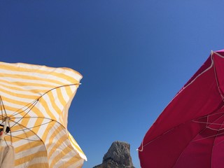 umbrellas at beach in calp, spain mediterranean coast