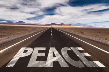 Peace written on desert road