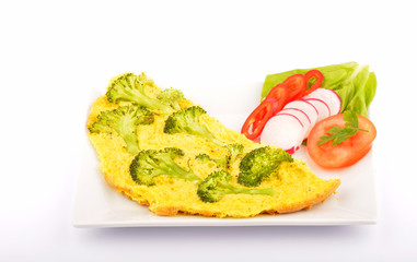 Delicious omelet with vegetables on plate