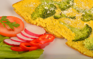 Delicious omelet with vegetables on plate
