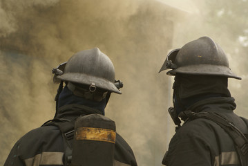 fire-fighter in breathing apparatus at building fire 