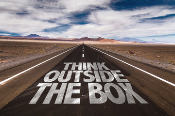 Think Outside the Box written on desert road