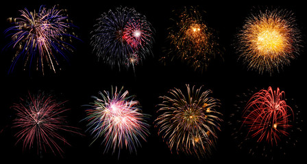 Colorful holiday fireworks on black sky background