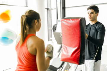 Young woman boxing and training
