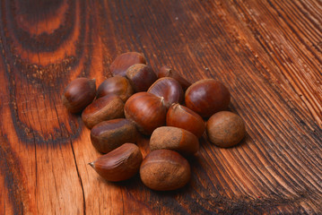 Chestnuts on wooden background