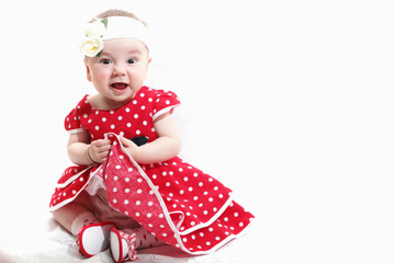 little girl in a red dress and beads