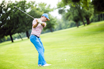 Golfer practicing and concentrating before and after shot