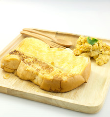 honey toast with omlette on wood dish