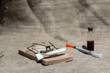 Drugs in a mousetrap cant dose syringe