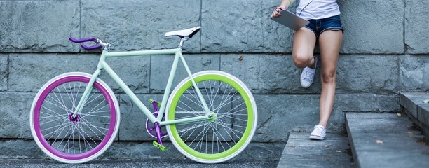 Biker girl with tablet