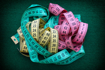Colorful measuring tapes pile