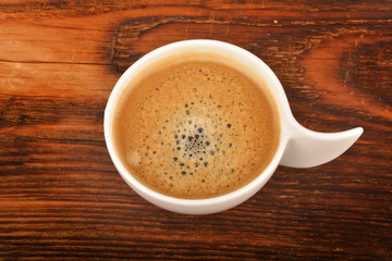 Coffee cup on wooden table.