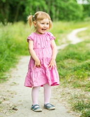 Cute little girl on the meadow 