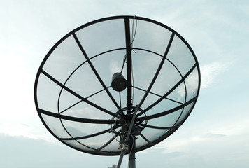 Satellite dish with blue sky background